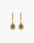 Gold earrings with gemstones on a white background